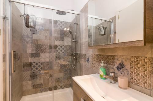 a bathroom with a sink and a shower at Milena's Country House in Pelekas