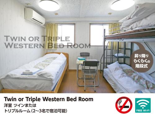 Una cama o camas en una habitación de Hotel Raizan North