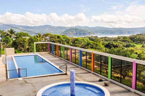 a house with a swimming pool on a balcony with a view at Monte Terras in Tronadora
