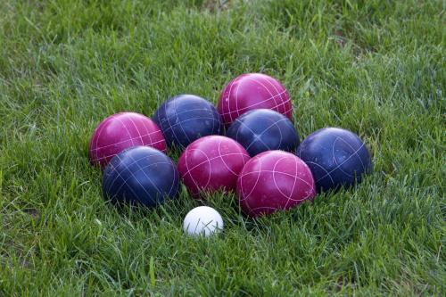 a group of different colored balls in the grass at Sun 'n Chill, Boutique Apartments & Beach Villa in Melíkia