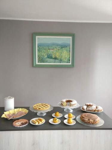 a table topped with lots of different types of food at B&B Molinetto in Piacenza