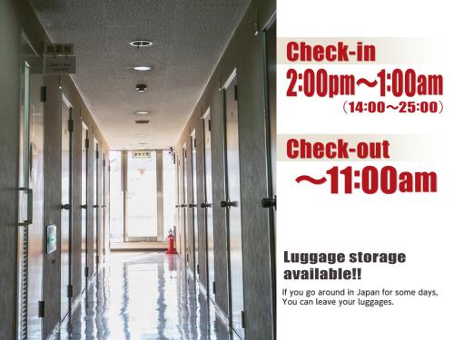 a hallway of a building with a sign that reads check in crore at Hotel Raizan South in Osaka
