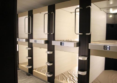 a row of closet doors in a room at Fujikyu Unjokaku in Narusawa