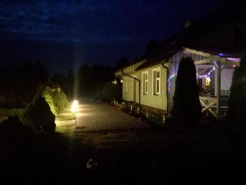 a train car with a light in the dark at Rähni Guesthouse Lake Peipsi in Vilusi