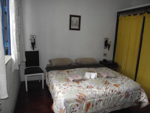 Katil atau katil-katil dalam bilik di Hotel Miguel Pereira