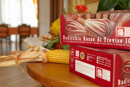 a table with a box of pasta and corn on it at Agriturismo il Cascinale in Treviso