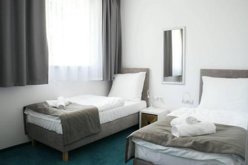 Un ou plusieurs lits dans un hébergement de l'établissement Hotel Inner City