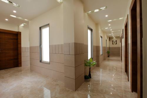 a hallway in a building with a hallway sidx sidx sidx at Hotel Alka Inn in Ahmedabad