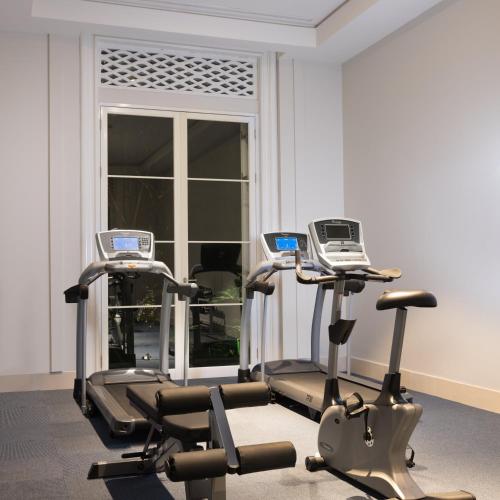 two exercise bikes in a gym with a window at Rumah Luwih Bali in Keramas