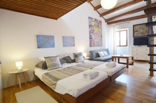 Posteľ alebo postele v izbe v ubytovaní Dala Apartment