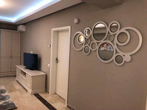 a room with a bunch of mirrors on the wall at Luxury Apartment Sophia 3 - DaviDary in Mamaia