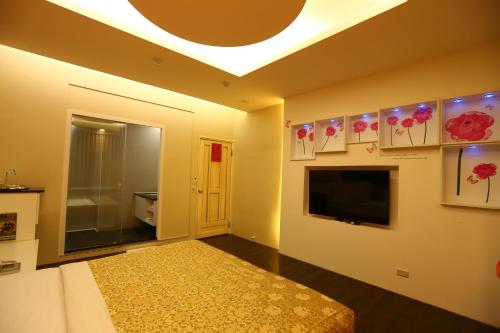 Ένα ή περισσότερα κρεβάτια σε δωμάτιο στο Yuan Chyau Motel