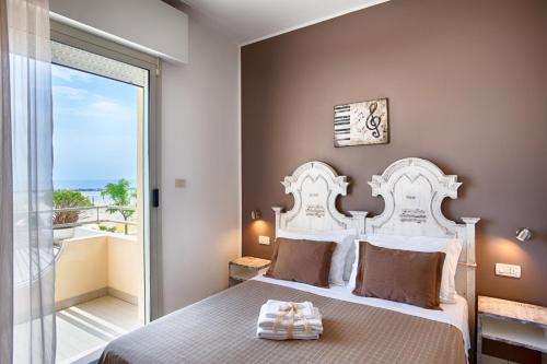 Postel nebo postele na pokoji v ubytování Hotel Villa Esedra