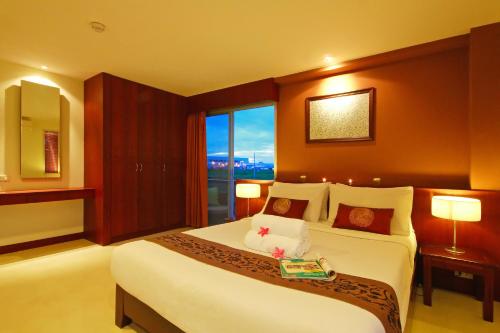 Postelja oz. postelje v sobi nastanitve Floral Shire Suvarnabhumi Airport - SHA Extra Plus
