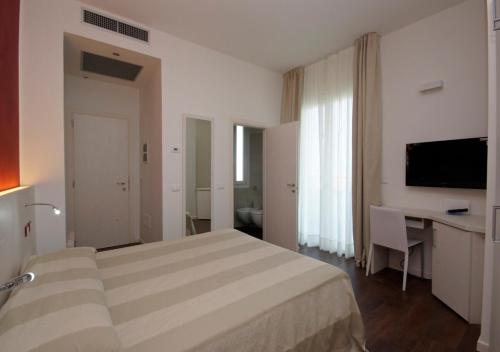 Postel nebo postele na pokoji v ubytování Hotel Aragosta