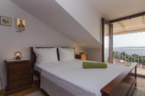 Posteľ alebo postele v izbe v ubytovaní Apartman Podgora