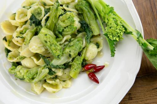 a plate of pasta and broccoli on a table at TENUTAYALA - Residenza Agrituristica in Parabita