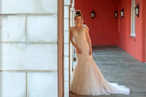 a woman in a wedding dress standing next to a ladder at Ben Nevis Hotel & Leisure Club in Fort William