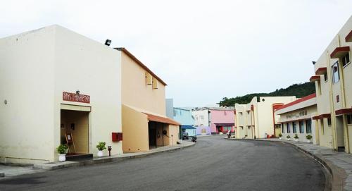 an empty street in a town with buildings at Shanthiniketan - Ramoji Film City in Pedda Ambarpet