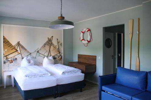 Ένα ή περισσότερα κρεβάτια σε δωμάτιο στο Havelhotel