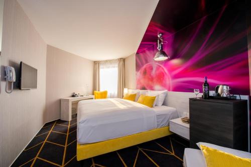 Un ou plusieurs lits dans un hébergement de l'établissement Science Hotel