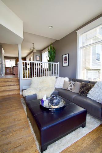 a living room with a couch and a table at Comfort and Grace Perched on Queen Anne Hill in Seattle