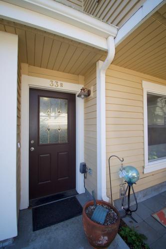 a front door of a house with a porch at Comfort and Grace Perched on Queen Anne Hill in Seattle