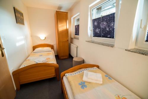 Ένα ή περισσότερα κρεβάτια σε δωμάτιο στο Bed & Breakfast Hisa Resje