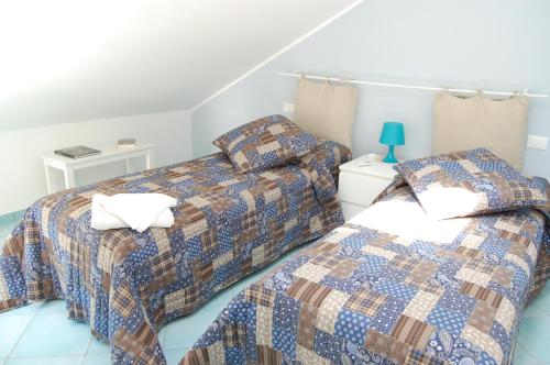 Krevet ili kreveti u jedinici u objektu Golfo di Tindari Apartments