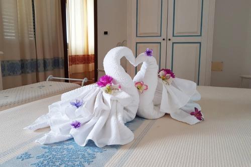 Ένα ή περισσότερα κρεβάτια σε δωμάτιο στο Guest House Villabianca