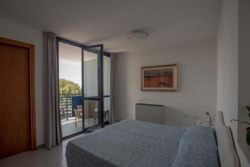 Postel nebo postele na pokoji v ubytování Hotel Sirenetta