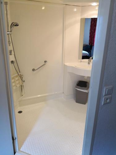 a bathroom with a shower and a sink at Quick Palace St Jean De Vedas - A709 in Saint-Jean-de-Védas
