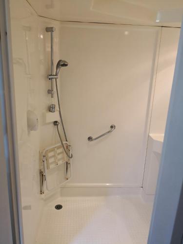 a bathroom with a shower stall with a shower at Quick Palace St Jean De Vedas - A709 in Saint-Jean-de-Védas