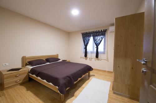 Un pat sau paturi într-o cameră la Villa Ljuba