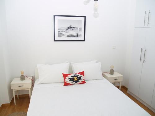 Postel nebo postele na pokoji v ubytování A Refreshed & Rich in Details Apartment in Piraeus (Passalimani - Marina Zeas)