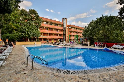 a large swimming pool in front of a hotel at Kamchia Park Hotel - All Inclusive & Free Parking in Golden Sands