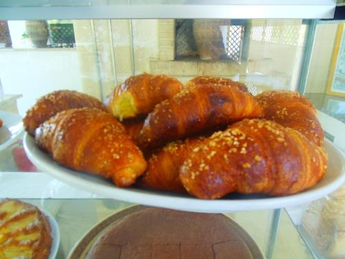 a plate of croissants and other pastries on a table at Missipezza Residence a Frassanito in Alimini
