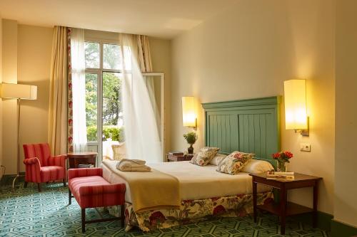 Postel nebo postele na pokoji v ubytování Hotel Palacio Urgoiti