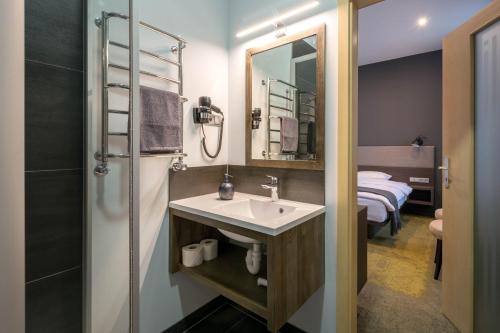 Ванная комната в Hotel Kolumbs