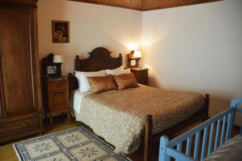 מיטה או מיטות בחדר ב-Casa Do Carvalho