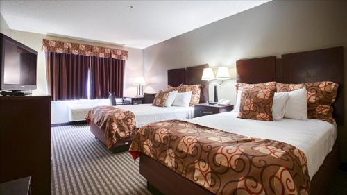 Ένα ή περισσότερα κρεβάτια σε δωμάτιο στο Econo Lodge