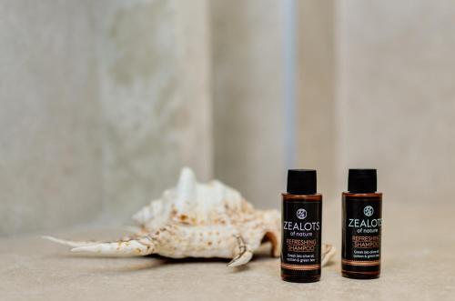 two bottles of essential oils next to a starfish at Pyrgos Blue in Malia