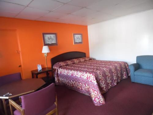 Postel nebo postele na pokoji v ubytování Tazewell Motel