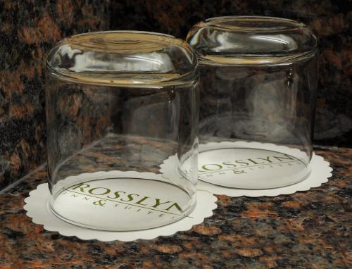 two glass jars sitting on top of a table at Rosslyn Inn & Suites in Edmonton