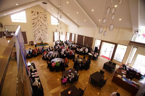 En restaurant eller et andet spisested på Grand Harvest Resort & Villas