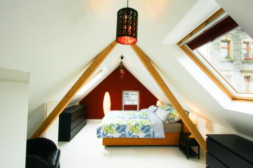 מיטה או מיטות בחדר ב-Ferienhaus Atelier