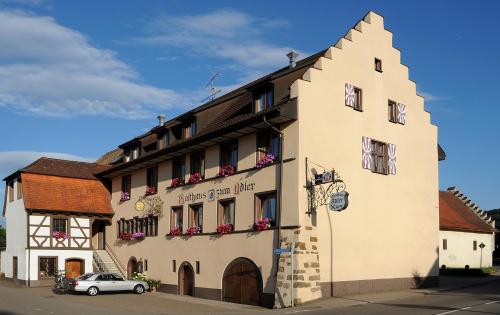 a building with a car parked in front of it at Der Adler in Lauchringen