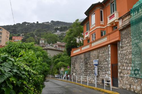 an empty street next to a stone building at Luxury Studio next to Monte Carlo in Beausoleil