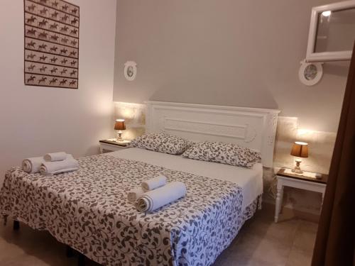 Ένα ή περισσότερα κρεβάτια σε δωμάτιο στο Casale Terra Sole B&B