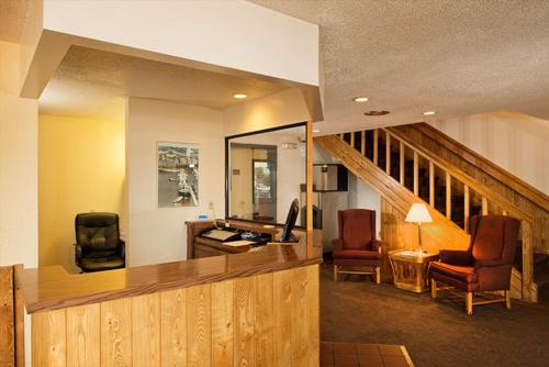 a living room with two chairs and a desk at Superior Inn in Superior